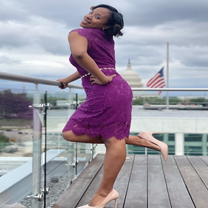 reviewer wearing the purple dress