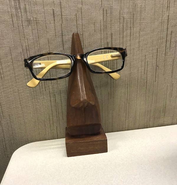 A reviewer&#x27;s glasses on the stand