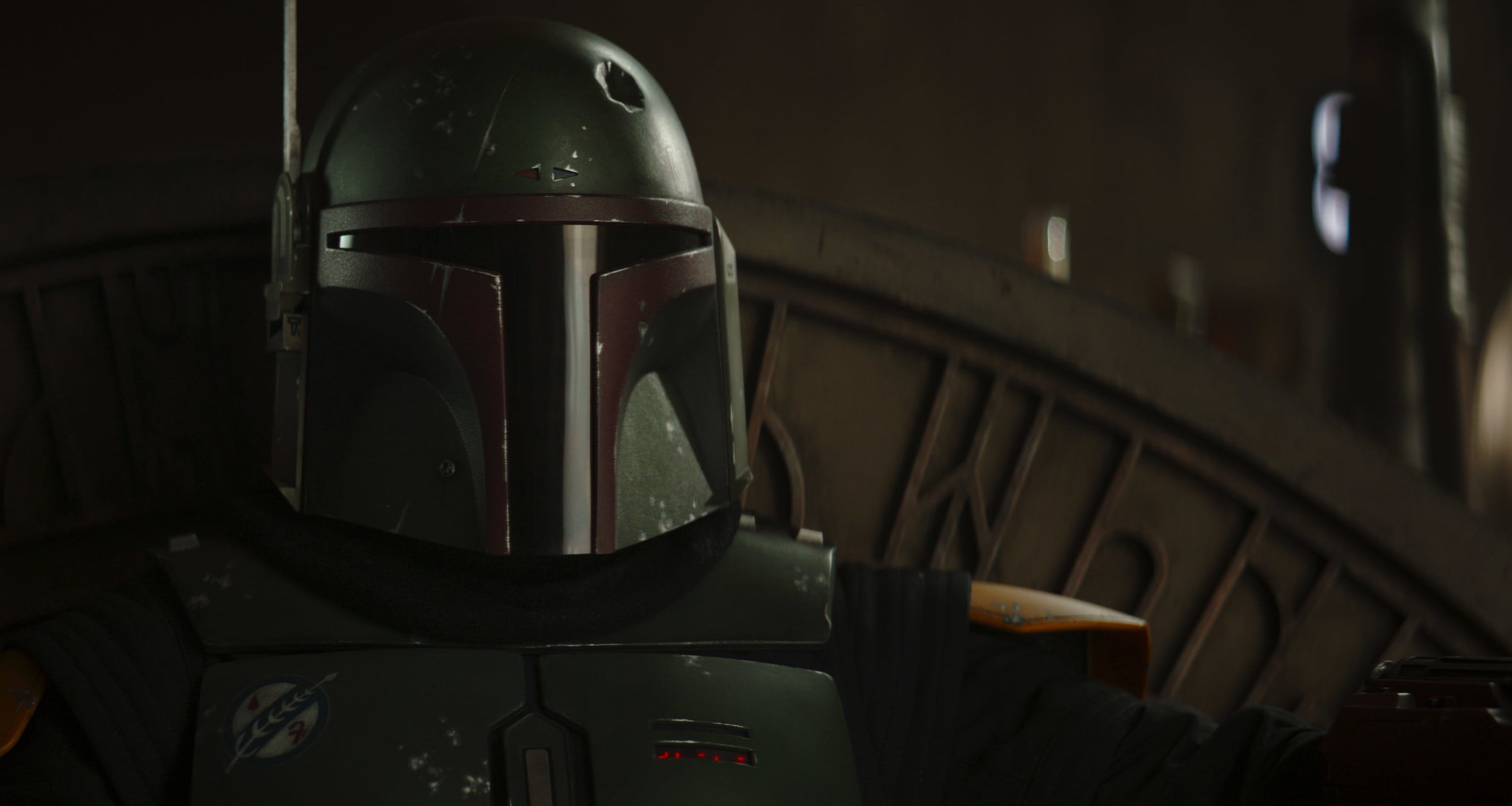 Boba Fett sits with his mask on