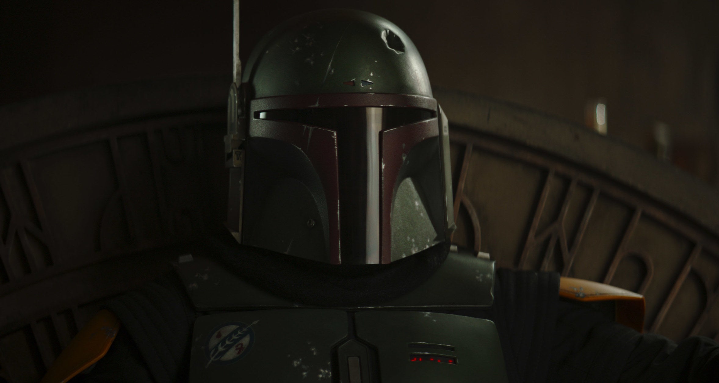 Boba Fett sits with his mask on