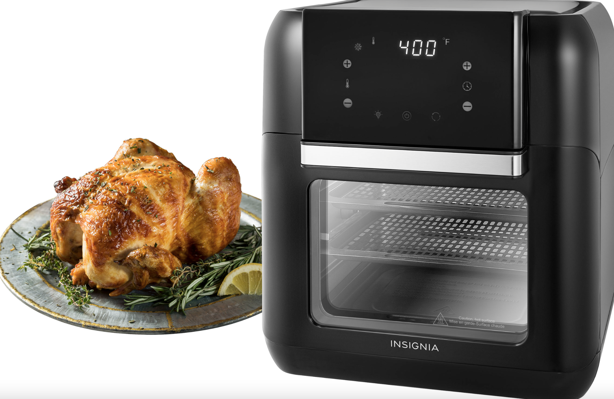 black air fryer next to a plate with a rotisserie chicken