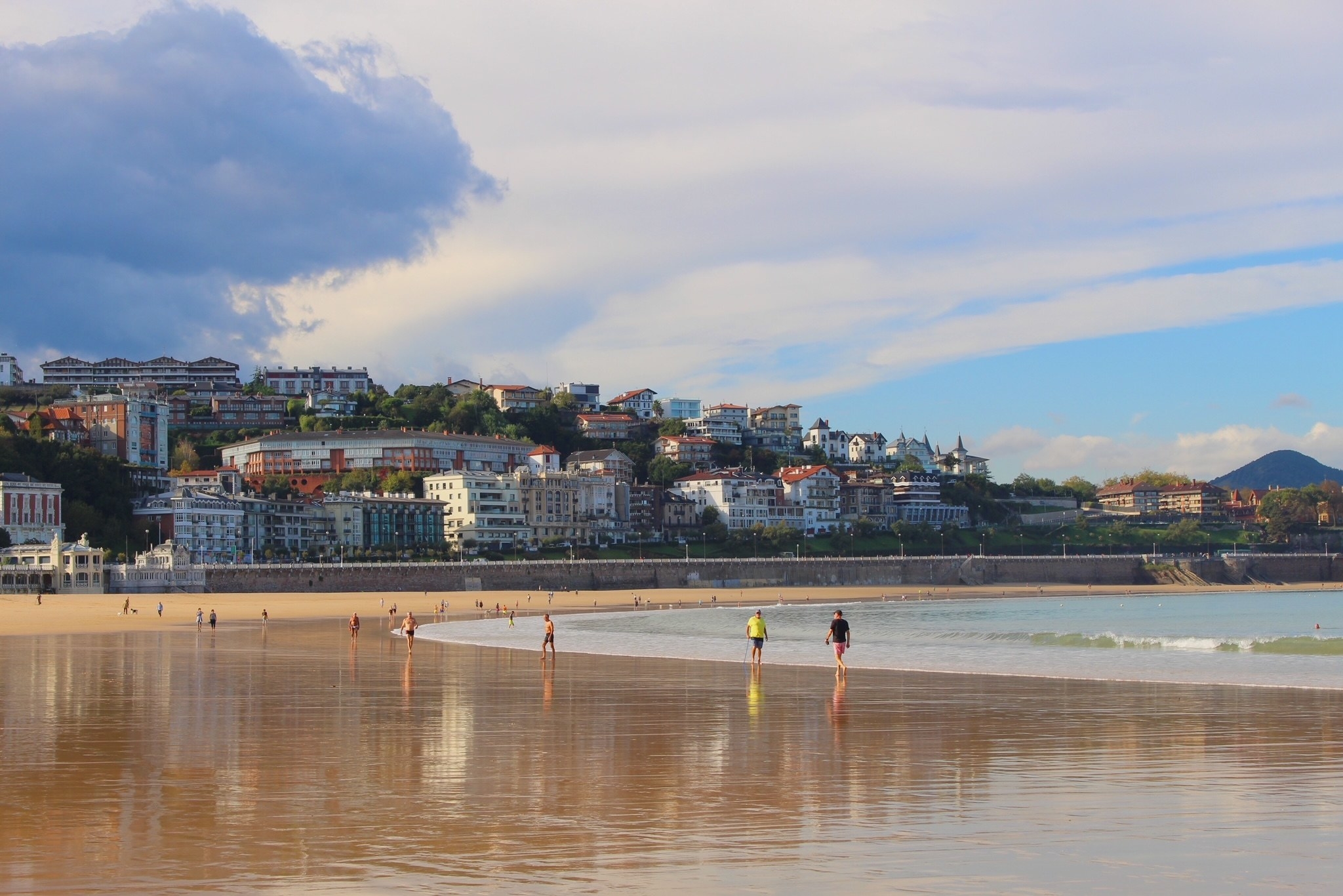 People walking on a beach.