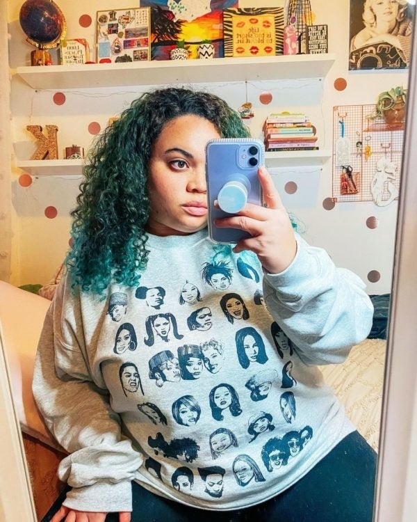 BuzzFeed buying  exertion   wearing a grey  sweatshirt with a people     of pistillate  rappers connected  it