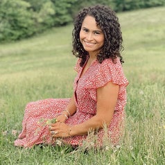 reviewer wearing the red dress