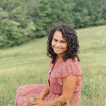 reviewer wearing the red dress