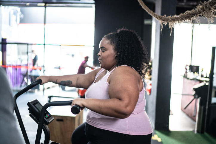 Plus-size person exercising in the gym