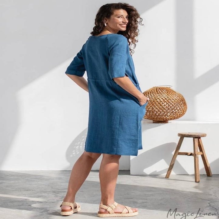 model wearing the blue dress