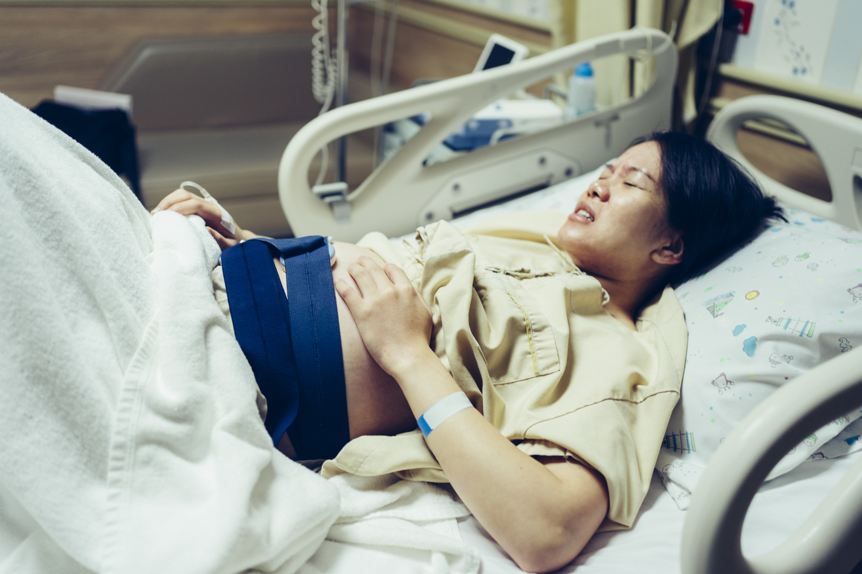 Asian woman giving birth in a hospital