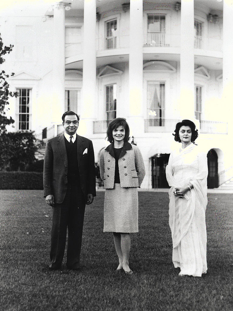 Jaqueline Kennedy, center, poses for a photograph with the Maharajah and Maharani of Jaipur October 24, 1962 at the White House