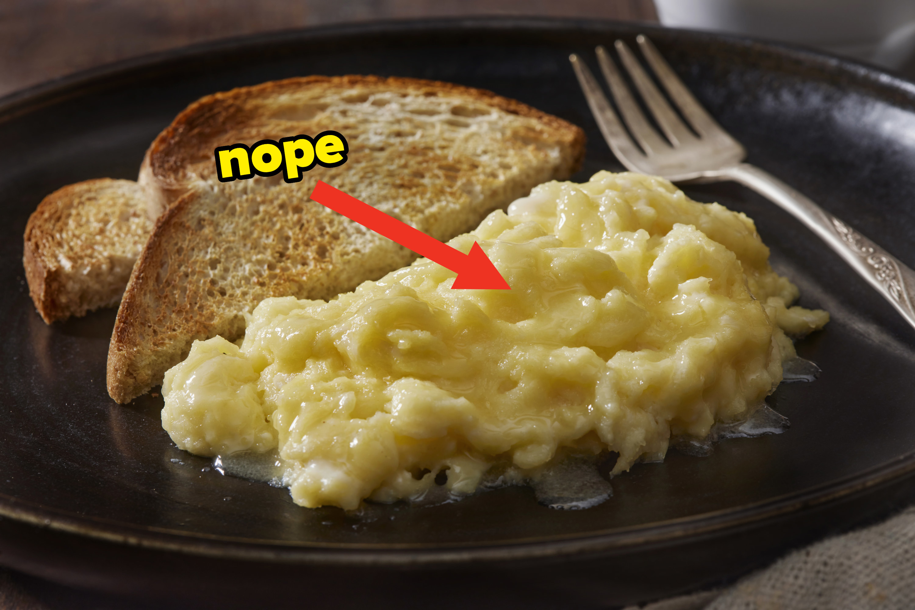 &quot;No&quot; pointing to loose, watery scrambled eggs
