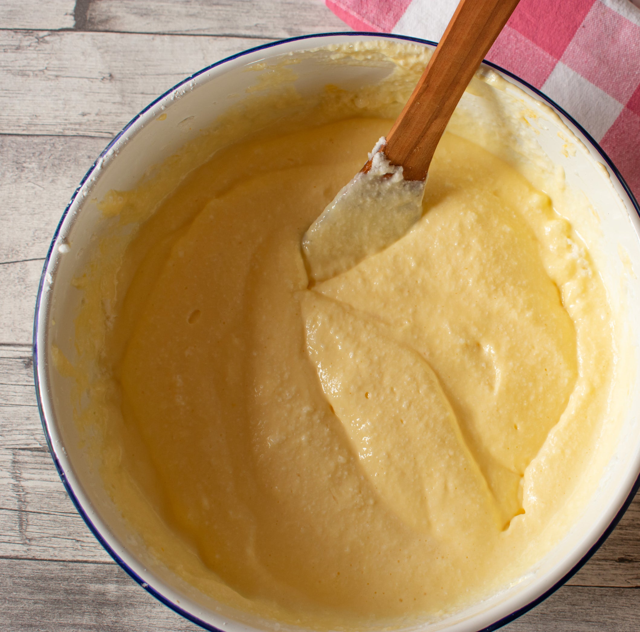 Yellow cake batter mixed in a large mixing bowl