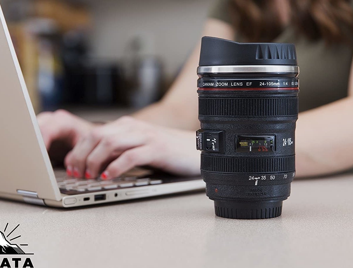 The camera lens thermos on someone&#x27;s desk