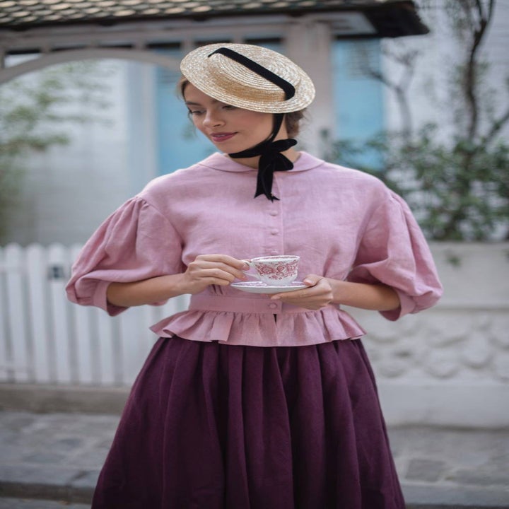 model wearing the pink blouse