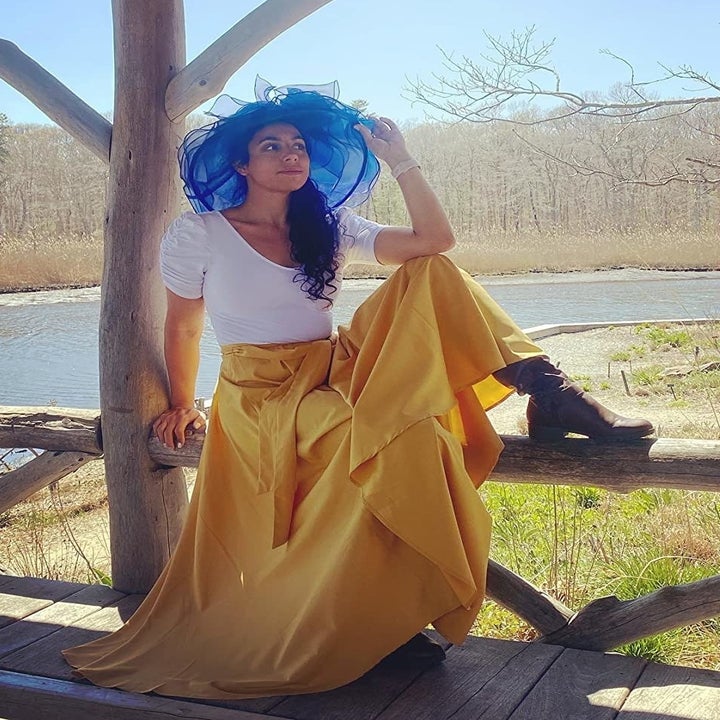 reviewer wearing the yellow skirt