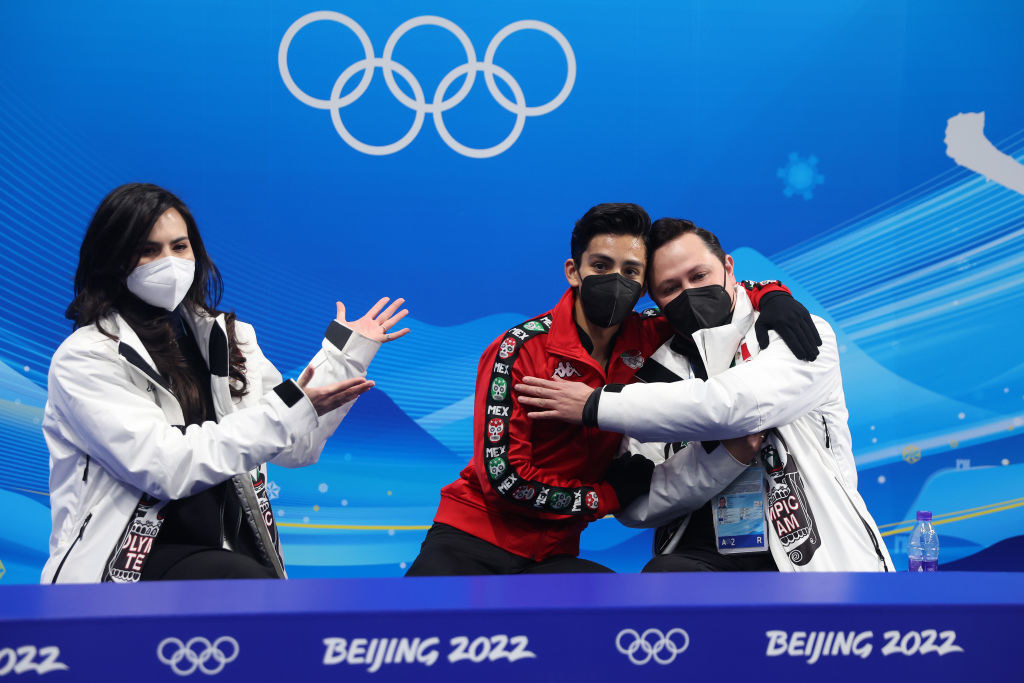 Donovan Carrillo and his coach hugging following the Men Single Skating Short Program