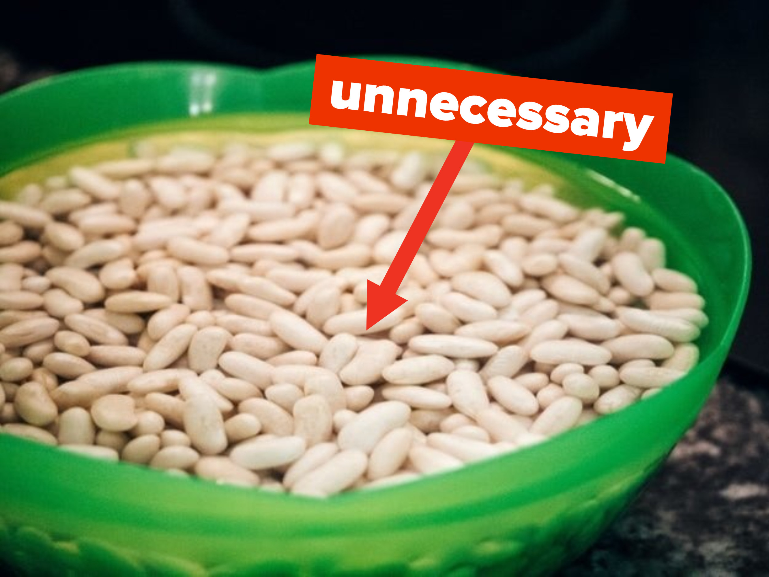 beans soaking in a green bowl with text &quot;unnecessary&quot;