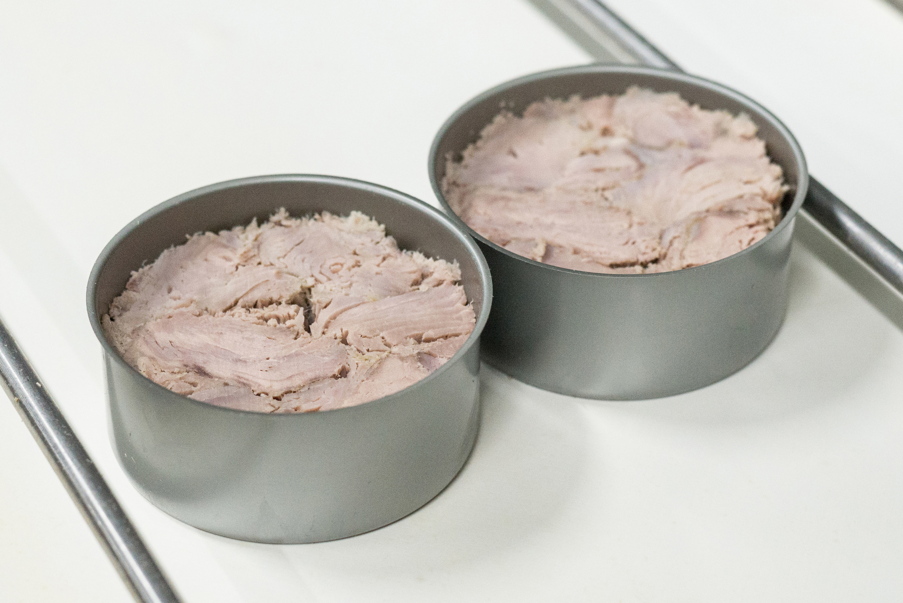 two tins of canned tuna