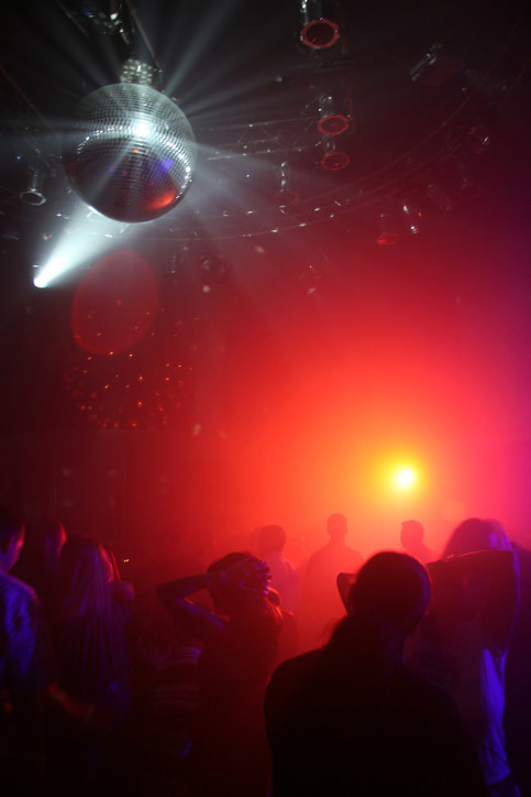 a nightclub party with a disco ball