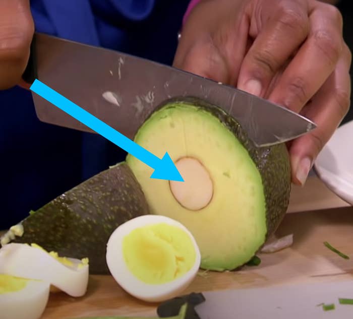 Contestant on &quot;Worst Cooks In America&quot; cutting through an avocado pit
