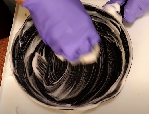 Scrubbing a cast iron skillet with soap
