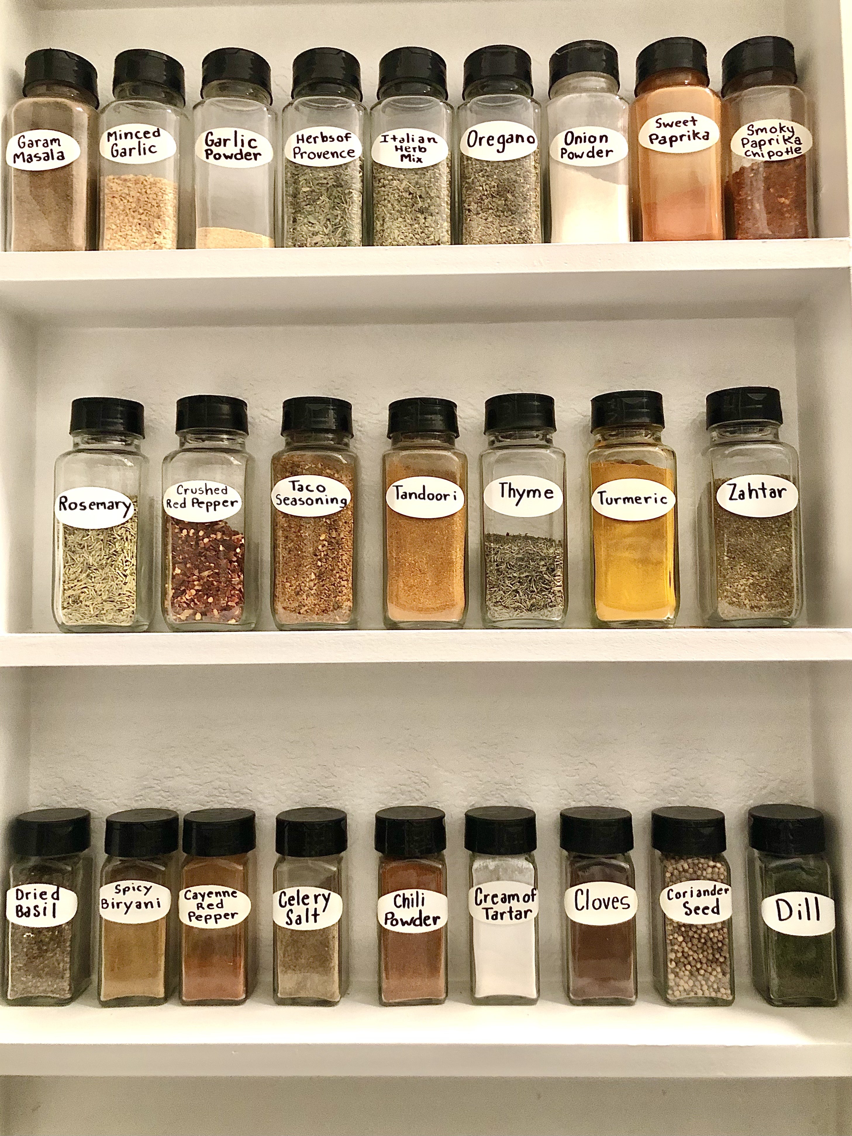 Large spice cabinet full of different kinds of herbs