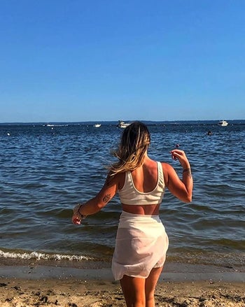 another reviewer wearing the white wrap