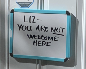 A sign reads &quot;Liz you are NOT welcome here&quot;