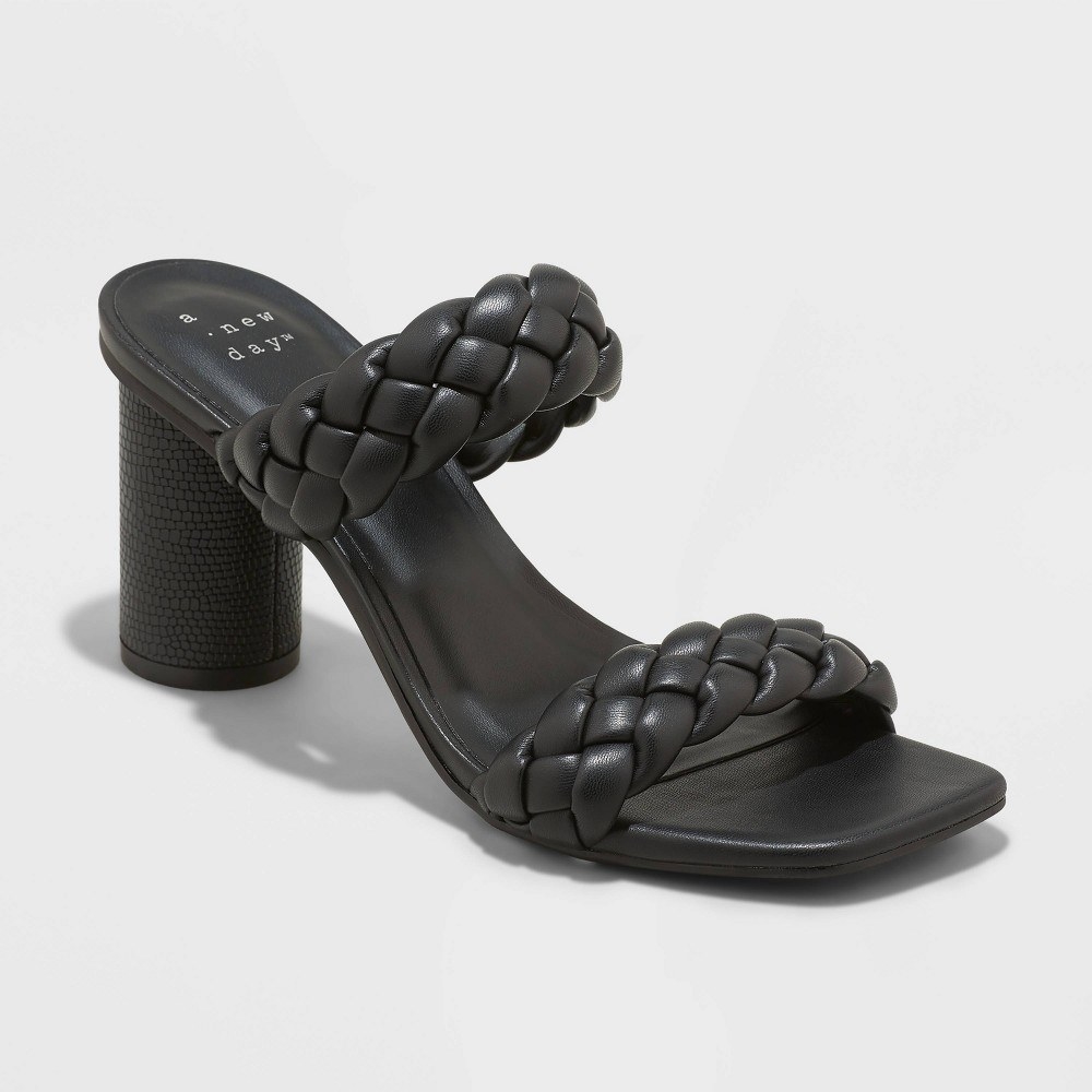 A black open-toe sandal with woven straps