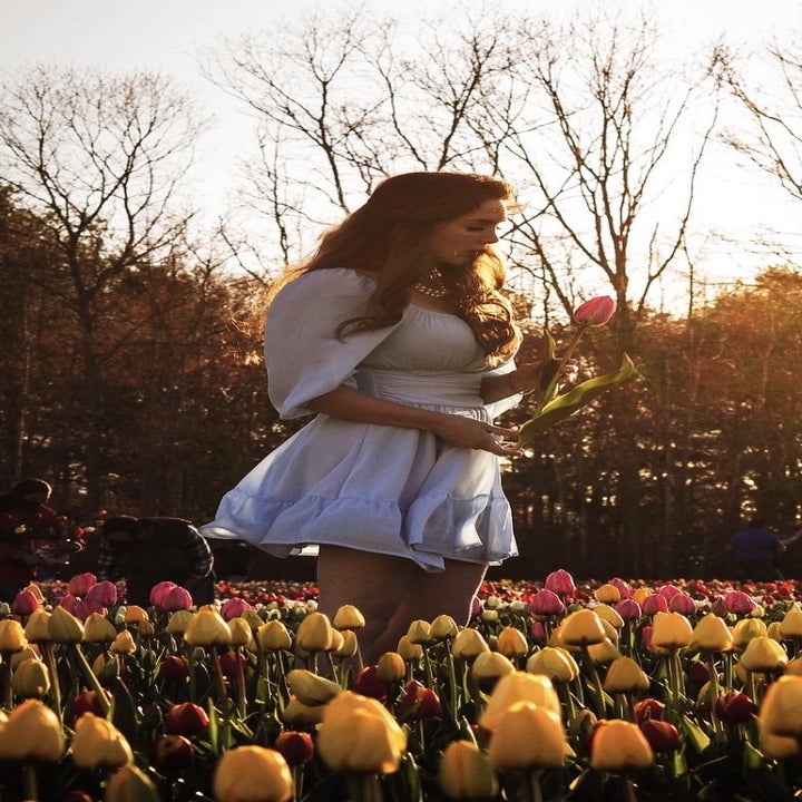 Reviewer wearing the blue  lantern sleeve tie dye back dress