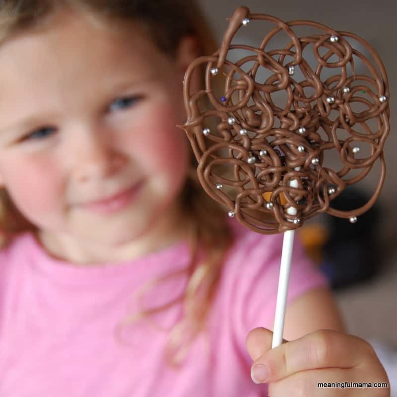 Blogger&#x27;s photo of their child holding the chocolate swirl lollipop