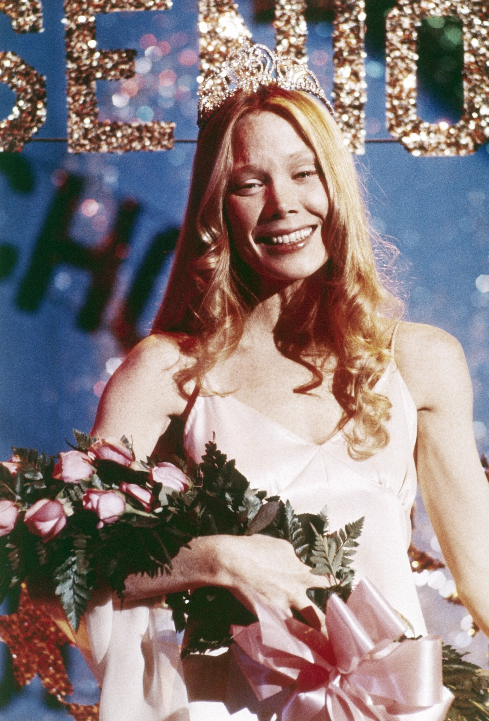 Carrie wearing her crown and holding her flowers