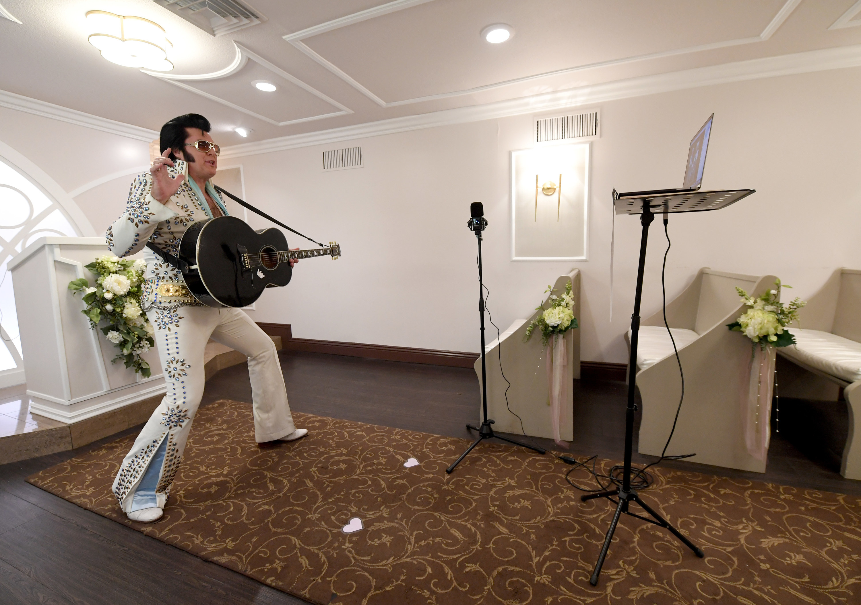 Elvis impersonator performing in a chapel