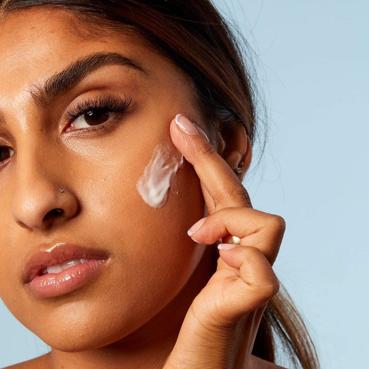model applying the moisturizer