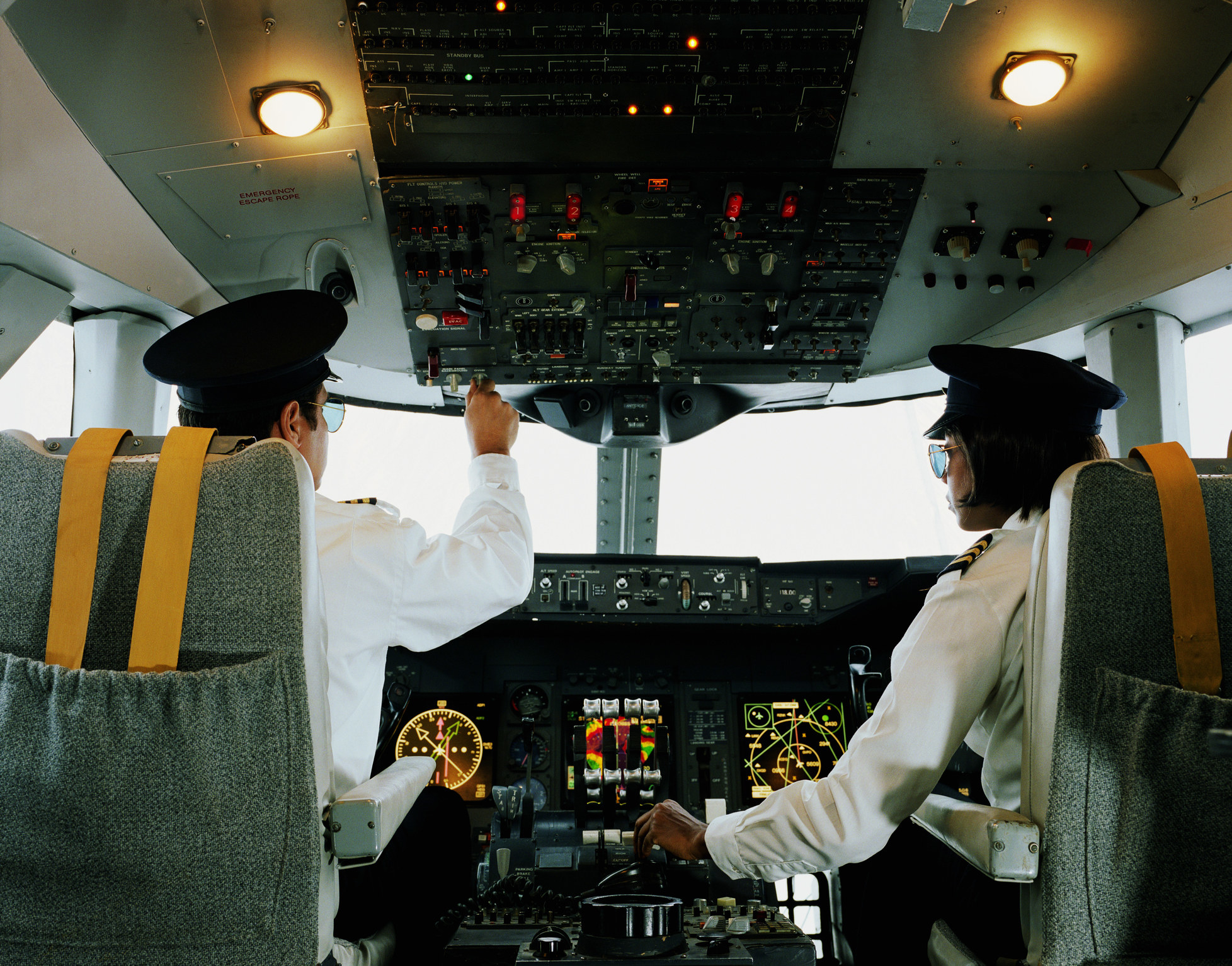 Two pilots in the cockpit monitoring the system