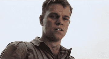 Matt Damon as young Private Ryan changing into Harrison Young as old Private Ryan, looking mournfully down.