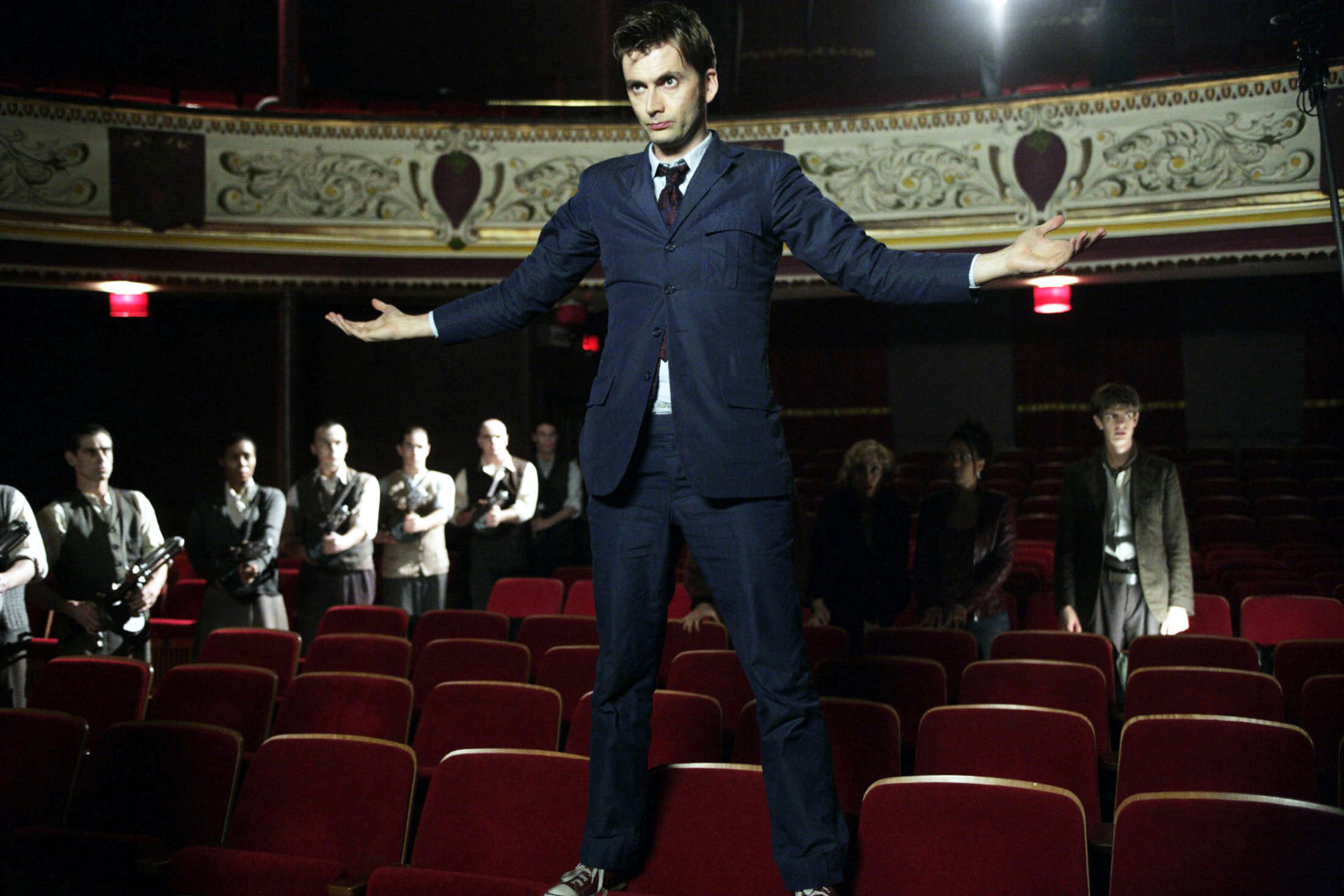 the doctor standing on theater seats