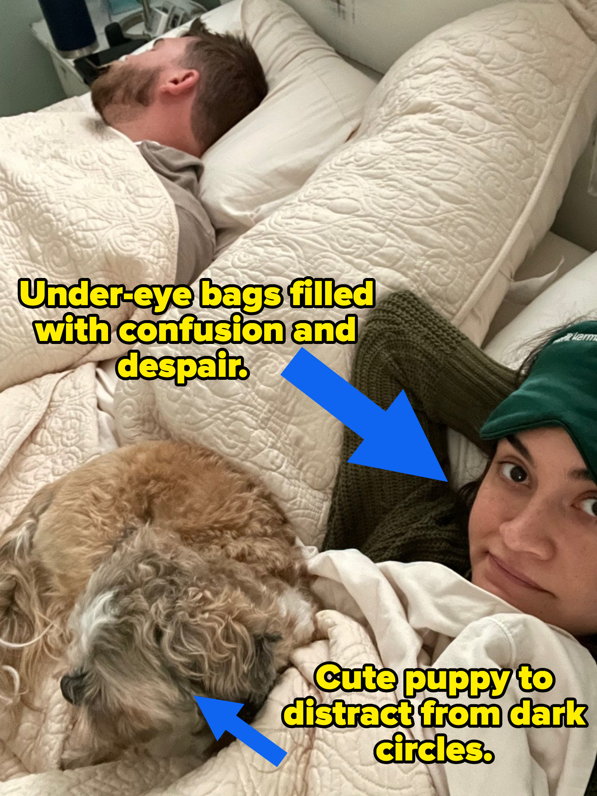 Raven Ishak lying in bed with a puppy