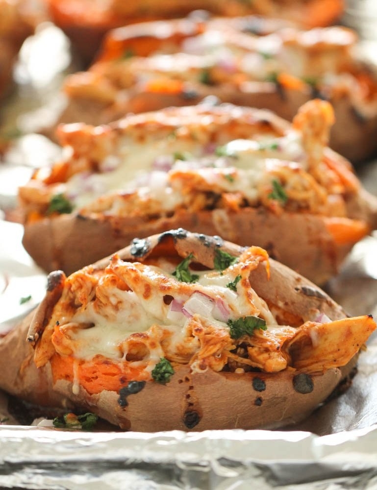 Baked sweet potatoes stuffed with shredded BBQ chicken.