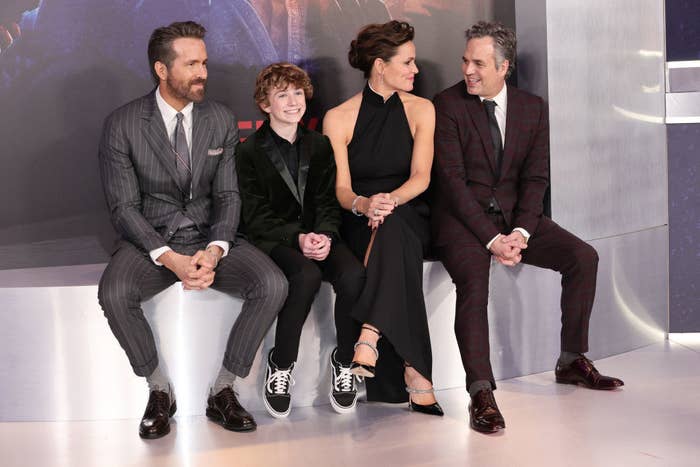 Jennifer and Mark sitting alongside Ryan and Braxton Bjerken at a photo call for their film The Adam Project