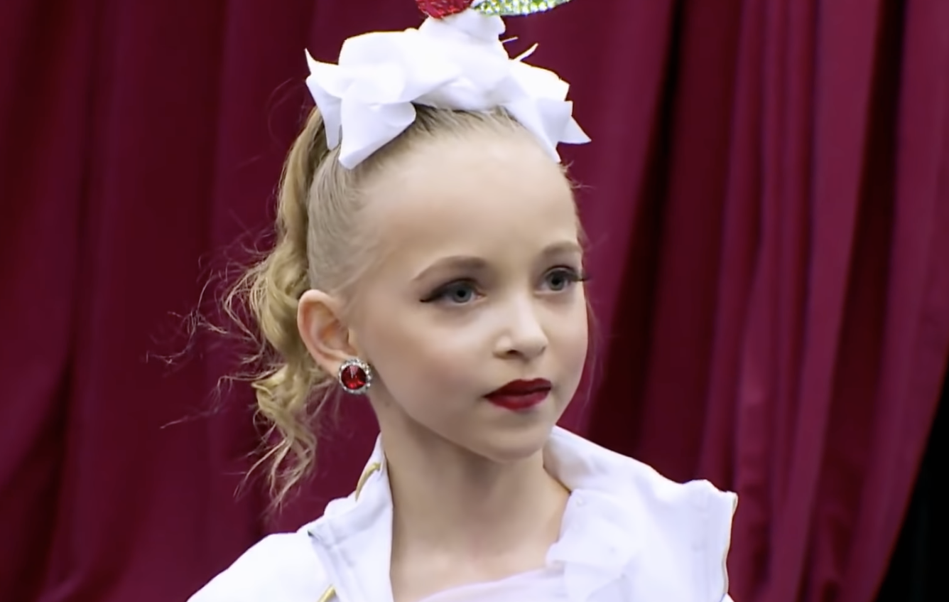 A young Lilliana in dance attire and make up