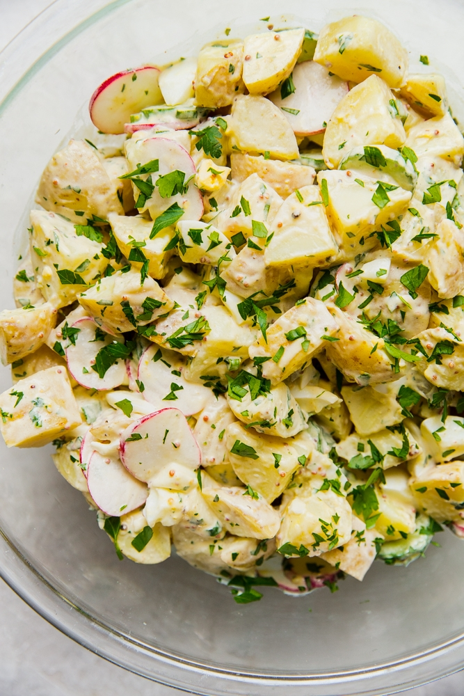 Potato salad with radishes and chives.