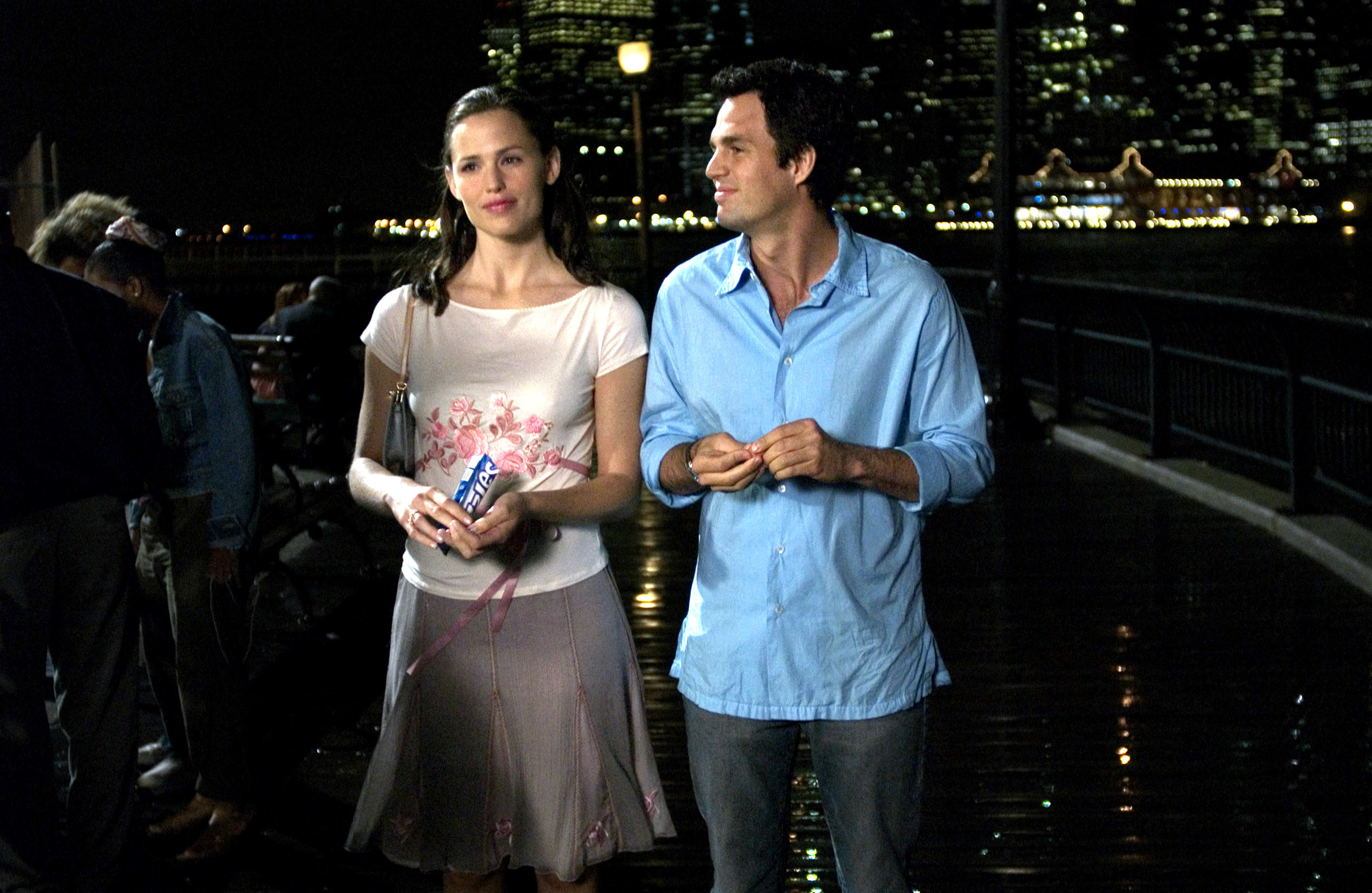 Jennifer and Mark walking outside at night in a scene from 13 Going on 30