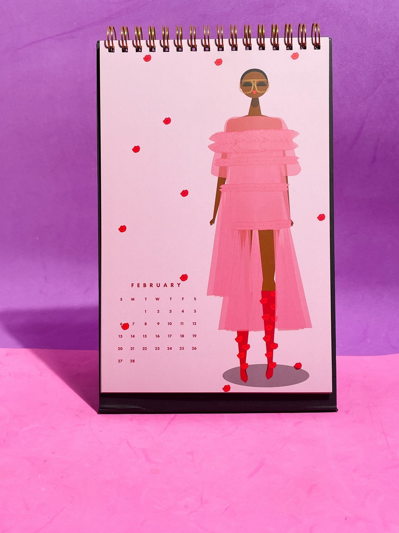 Pink desk planner on purple and pink background