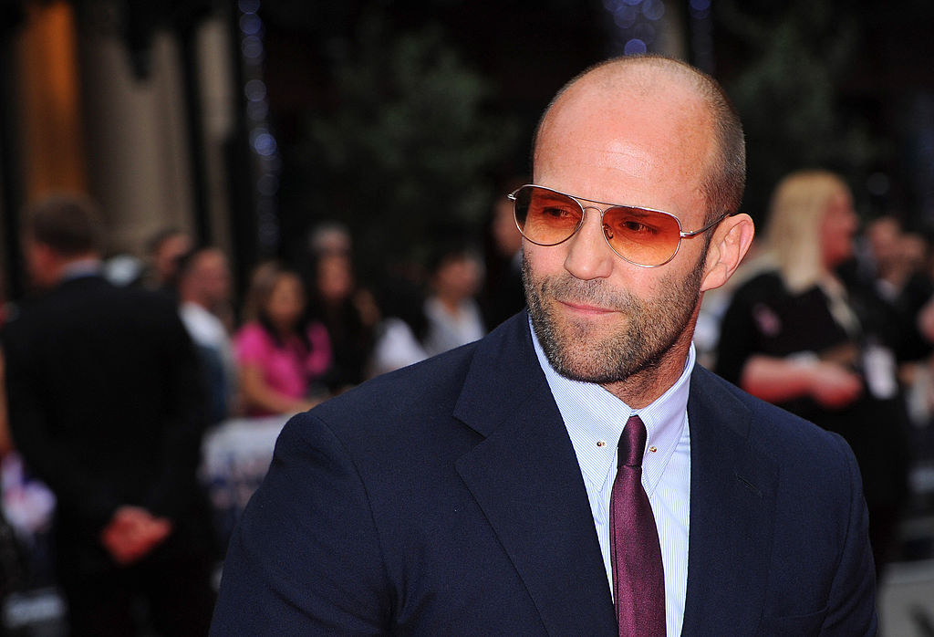 Jason posing in sunglasses on a red carpet
