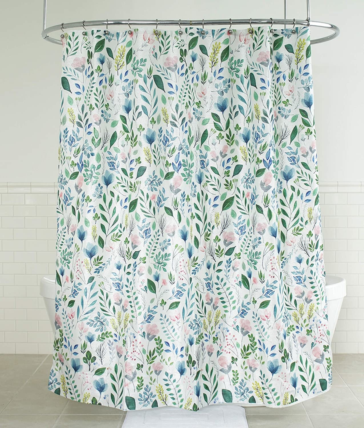 the shower curtain covered in flower and leaf illustrations