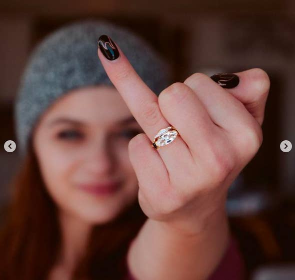 Joey holding up her ring finger to show off her new jewelry