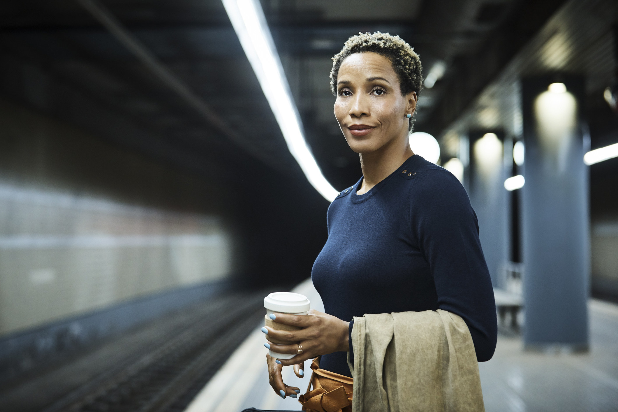 Businesswoman waiting for train at subway station