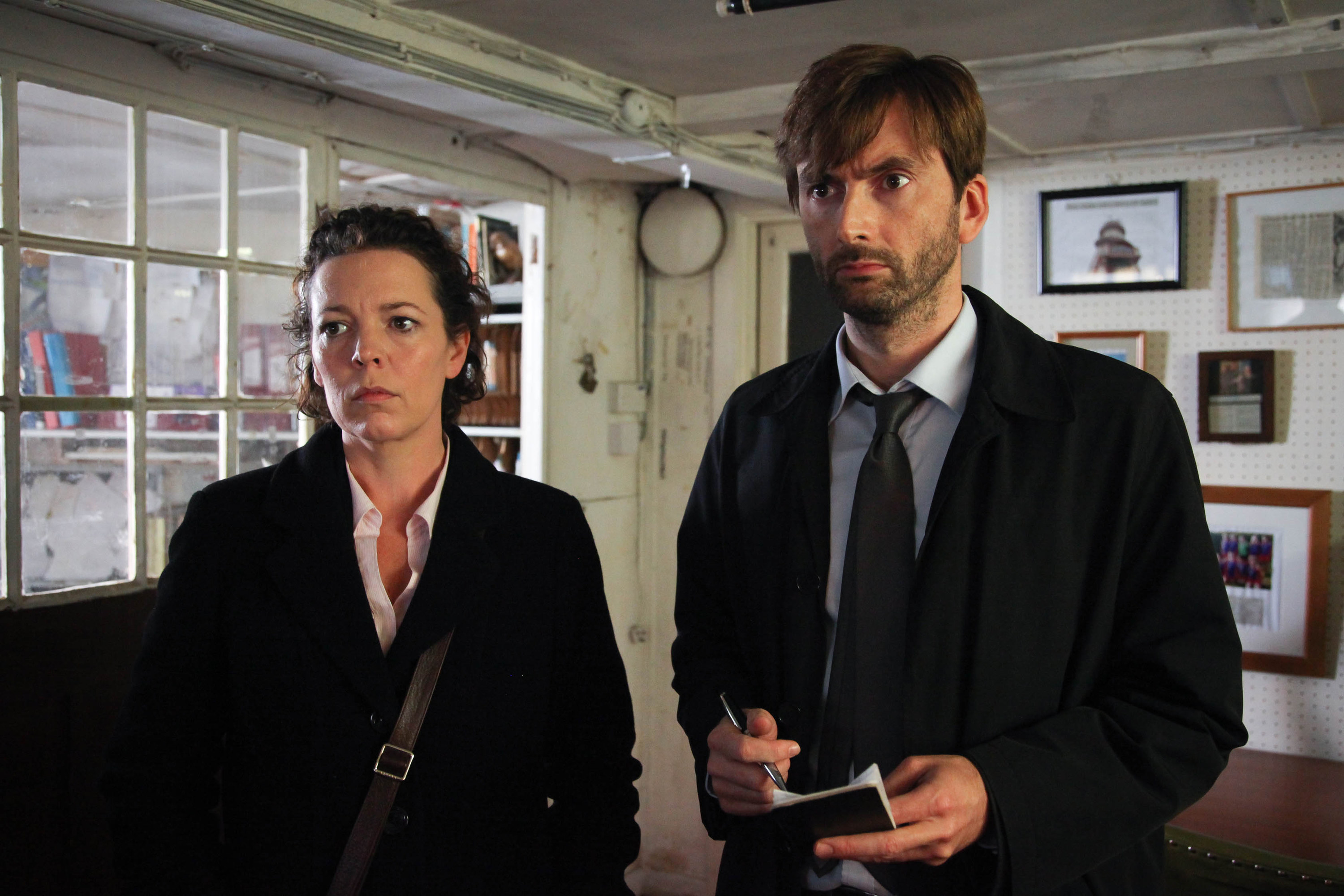 Olivia Colman and David Tennant standing next to each other.
