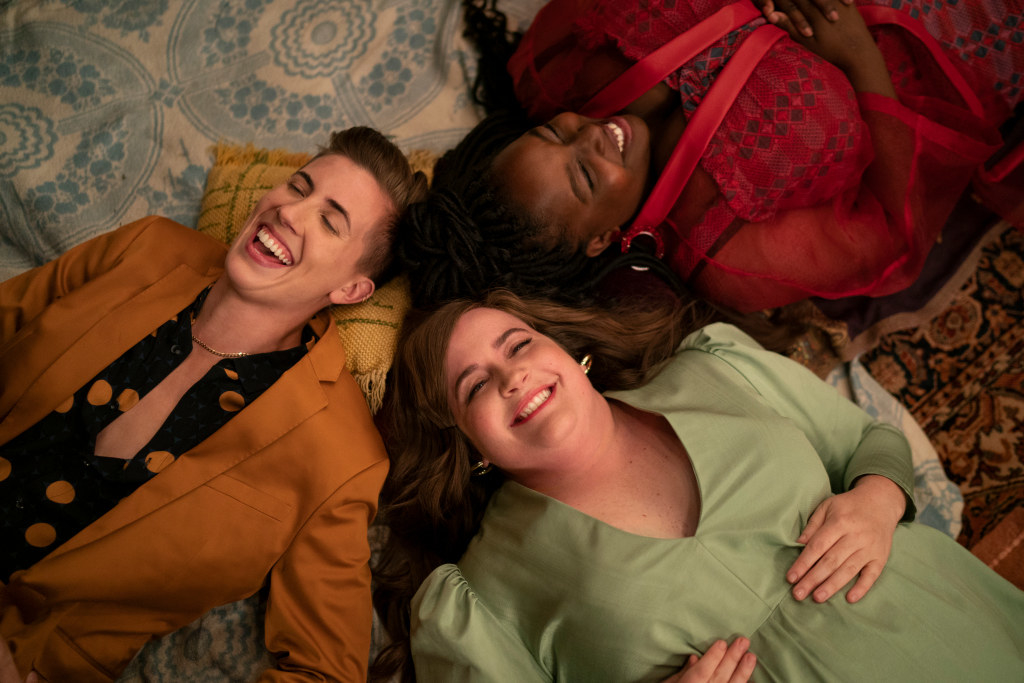 E.R. Fightmaster as Em, Aidy Bryant as Annie, and Lolly Adefope as Fran lie on the ground and laugh in &quot;Shrill&quot;