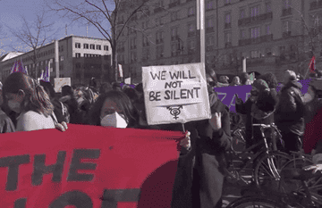 Sign that reads, &#x27;We will not be silent&#x27; during an International Women&#x27;s Day march